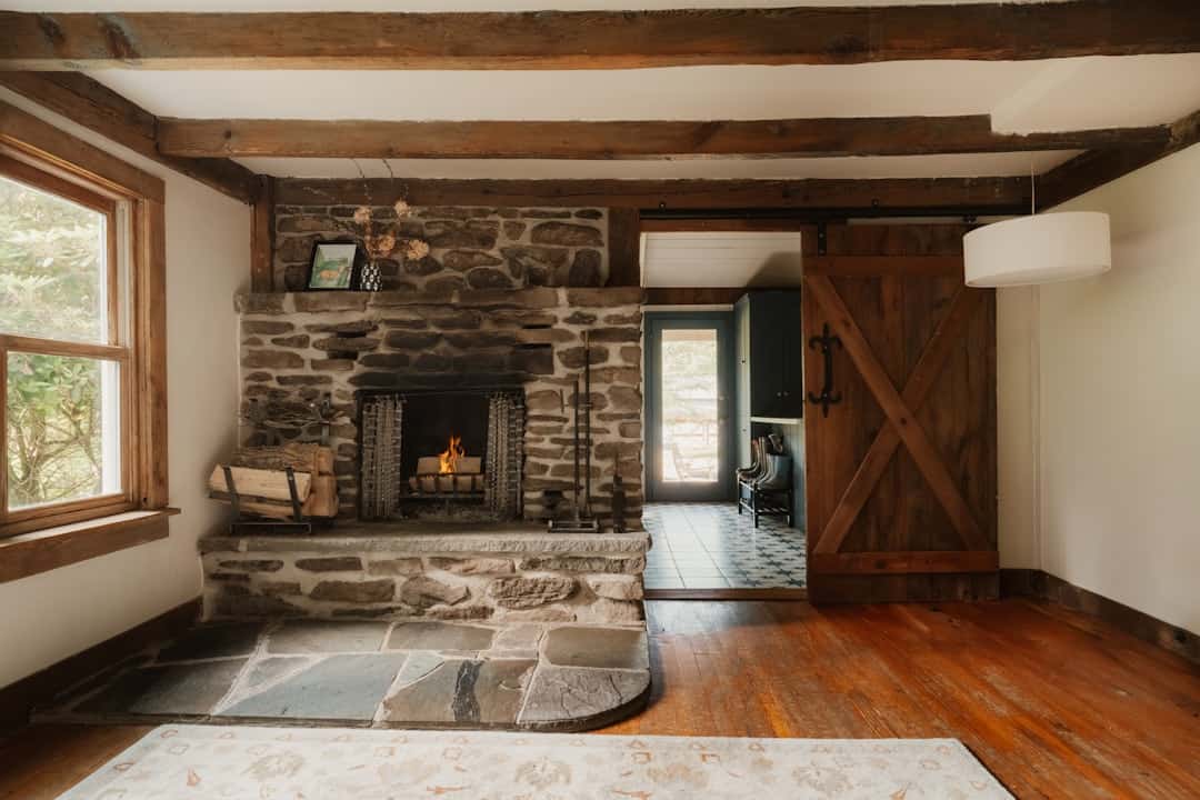 Warm stone fireplace in a refined home